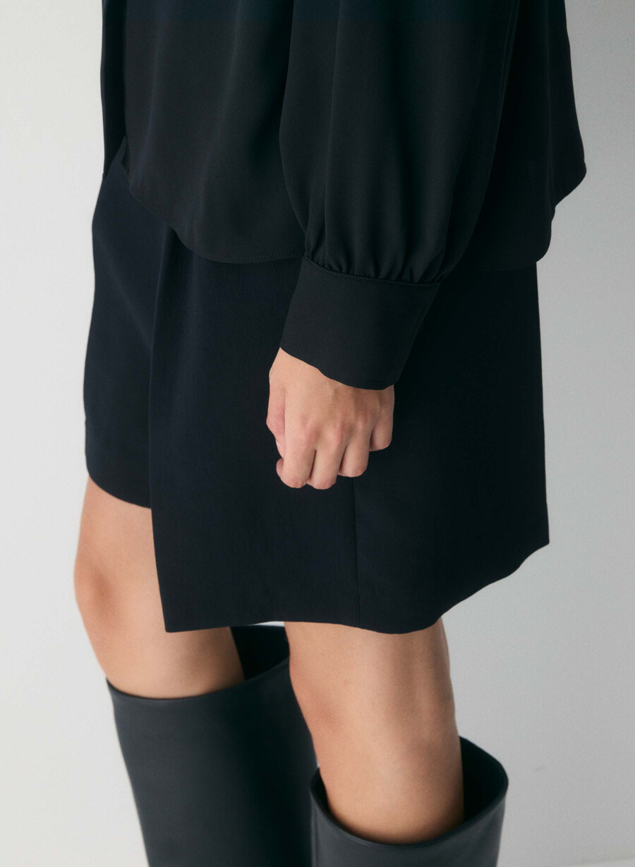 delphine blus svart