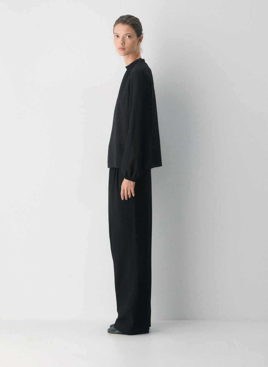 trinity-blus svart