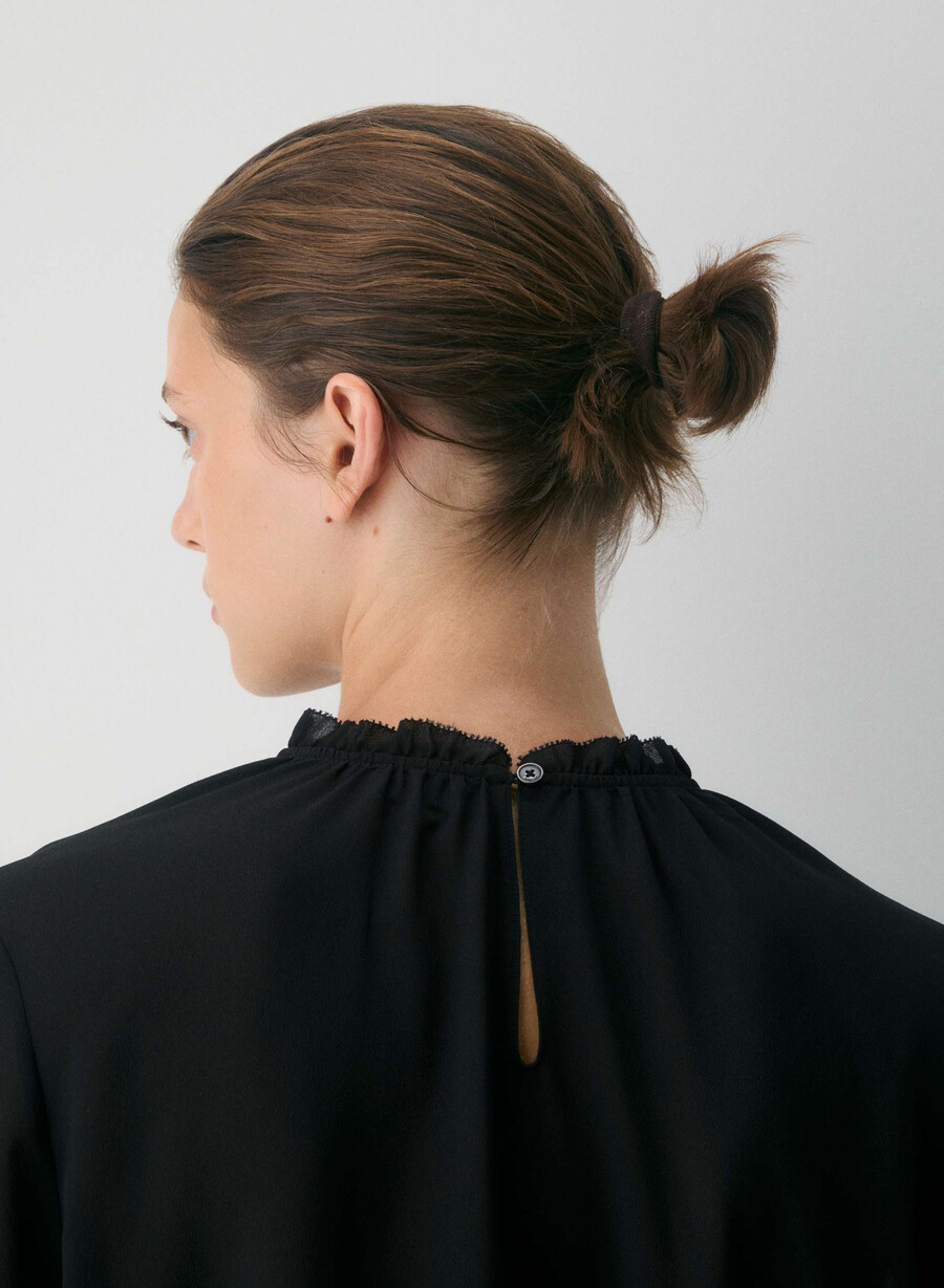 trinity-blus svart