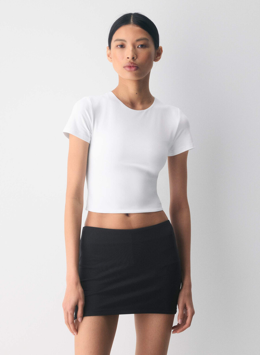 original contour marvel t-shirt med rund midja ljusvit