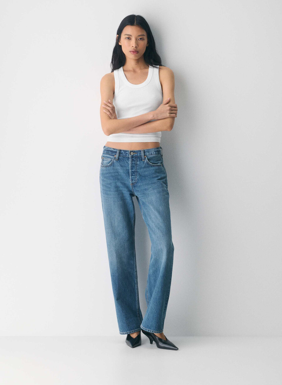 denim forum 90-tals vintagejeans med låg midja och manschett 5 år kiss n tell svart