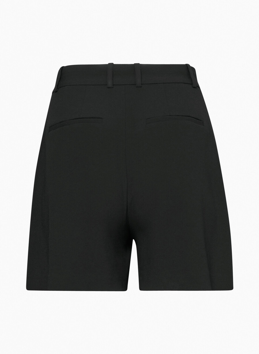 plisserade shorts till mitten av låret svart